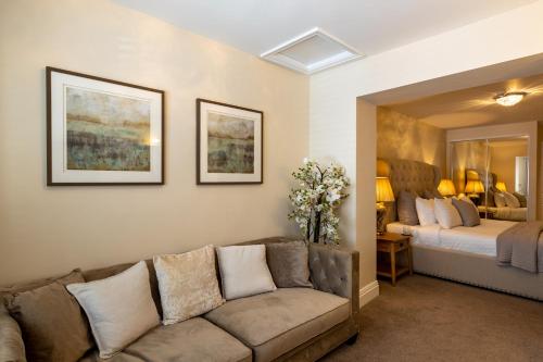 a living room with a couch and a bed at Lakes Hotel & Spa in Bowness-on-Windermere
