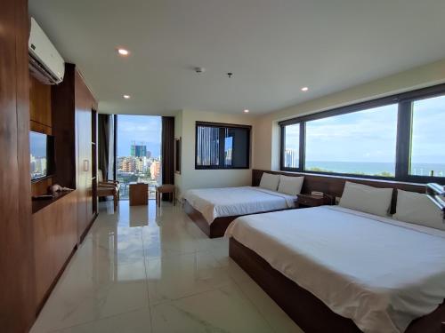 Postel nebo postele na pokoji v ubytování HỒNG HẢI 2 HOTEL