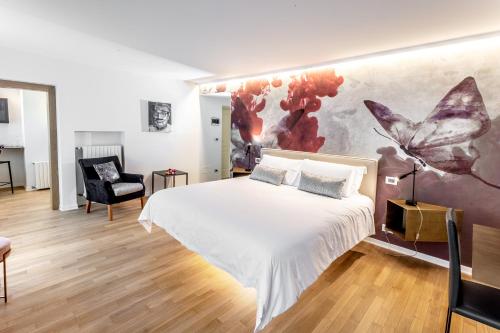 La Madernassa Resort - Casalora Dimora Storica di Charme tesisinde bir odada yatak veya yataklar
