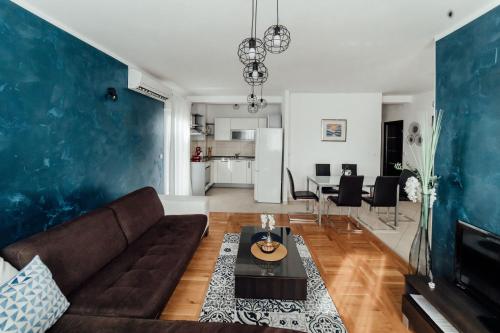 a living room with a couch and a table at Villa Lidija in Omiš