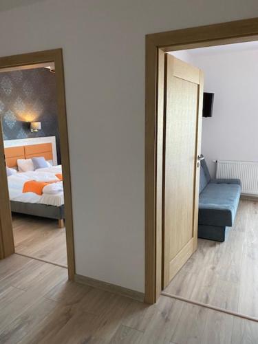 Cama o camas de una habitación en Pensjonat Latino