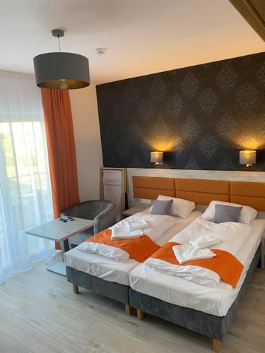 Cama o camas de una habitación en Pensjonat Latino
