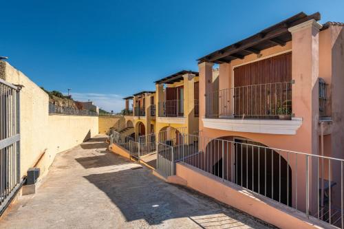 a row of buildings with gates and balconies on them at Luxury Apartment Simius in Villasimius