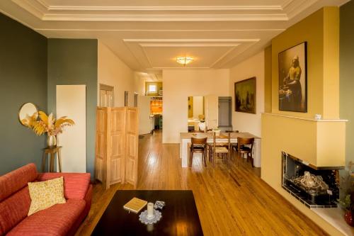 a living room with a couch and a table at Gunnery's Guest House in Alkmaar