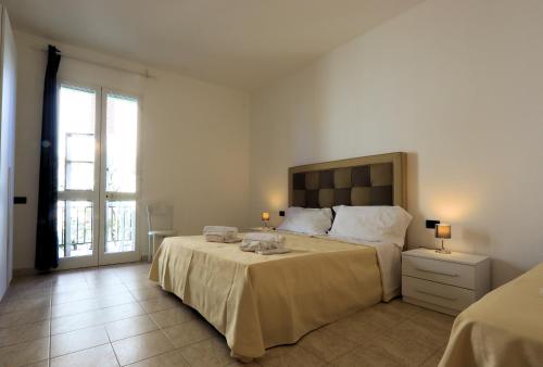 מיטה או מיטות בחדר ב-Bed & Parking Cecina Rooms