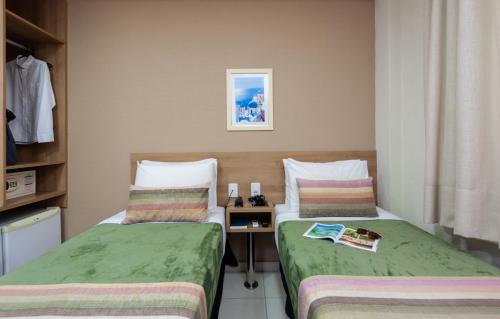 Postel nebo postele na pokoji v ubytování Hotel Olympia