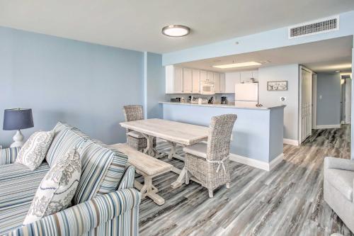 a living room with a table and chairs and a kitchen at Ocean-View Balcony North Myrtle Beach Condo! in Myrtle Beach