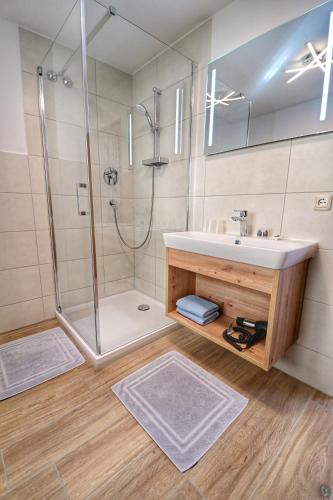 a bathroom with a sink and a shower at Gasthof Oberwirt in Ramsau