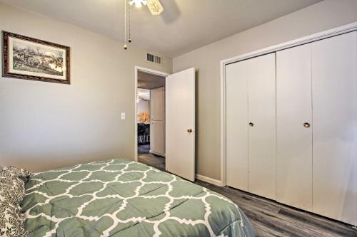a bedroom with a bed and a closet at 6 Mi to State Farm Stadium WFH-Friendly Home! in Sun City