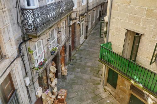an overhead view of an alley with a balcony at Hostal la Colegiata in Vigo