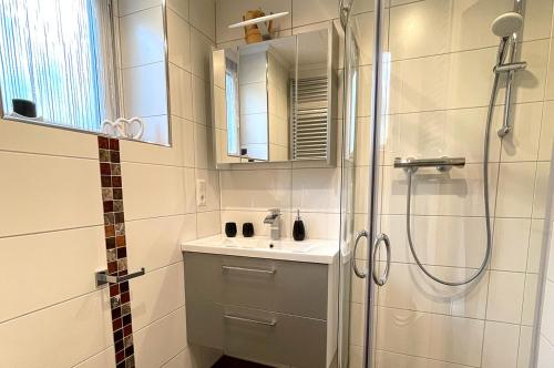 a bathroom with a shower and a sink at Ferienwohnung Nina Ortner Greifenburg in Greifenburg