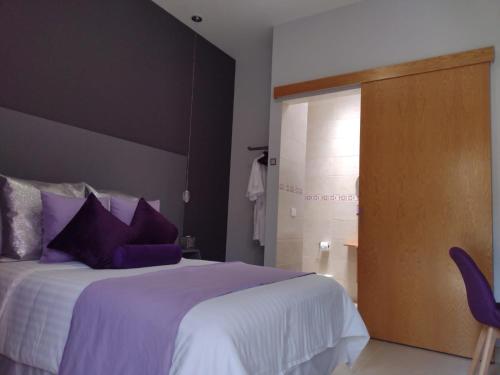 Ein Bett oder Betten in einem Zimmer der Unterkunft ArcoSodi Hotel Boutique