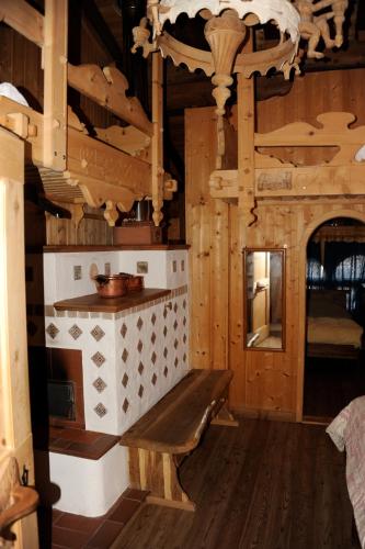a wooden room with a bench in a cabin at Agriturismo Randis in Piano dʼArta