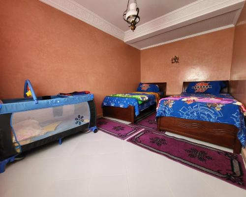 Säng eller sängar i ett rum på Villa plage tiguert