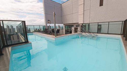 Swimming pool sa o malapit sa Flat 26º andar com vista para o mar- Próximo ao shopping e à praia