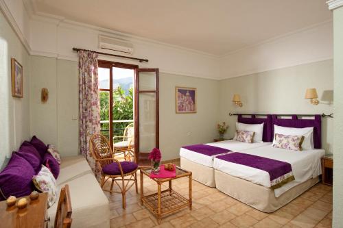 Postel nebo postele na pokoji v ubytování Malia Mare Hotel