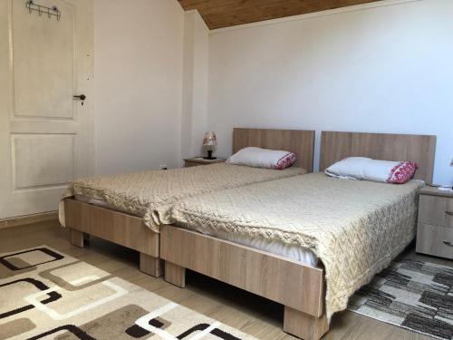 Кровать или кровати в номере Pensiune Agroturistica La Nasu