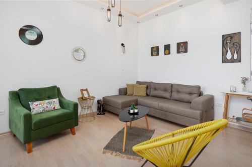 a living room with a couch and a chair at Defne's House View in Kotor