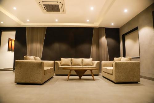 a waiting room with two chairs and a table at VIORAY INN in Deoghar