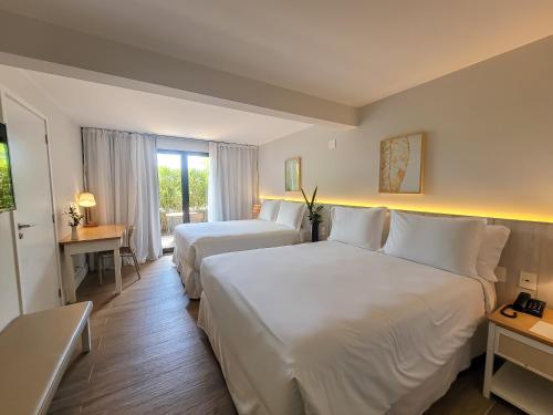 Postel nebo postele na pokoji v ubytování Hotel Aretê