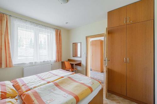 Postel nebo postele na pokoji v ubytování Apartmány Pod Sjezdovkou