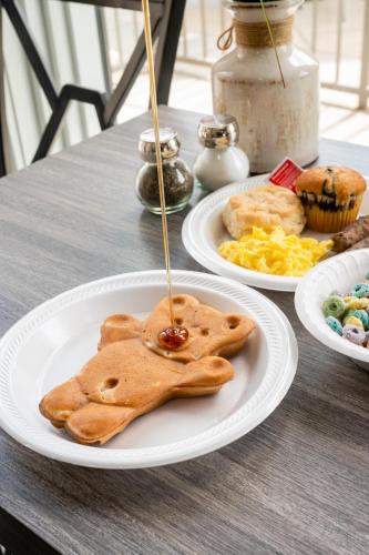 a plate of food with cookies on a table at Twin Mountain Inn & Suites in Pigeon Forge