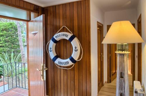 a room with a lifesaver hanging on the wall at Hotel Garbi in Calella de Palafrugell