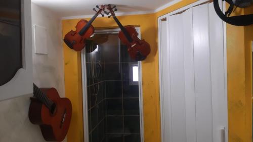 a room with guitars hanging on the wall at Airport Jackson Loft in Catania