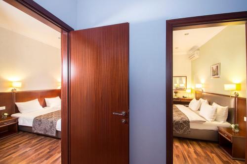 Postel nebo postele na pokoji v ubytování Greguar Hotel by UHM