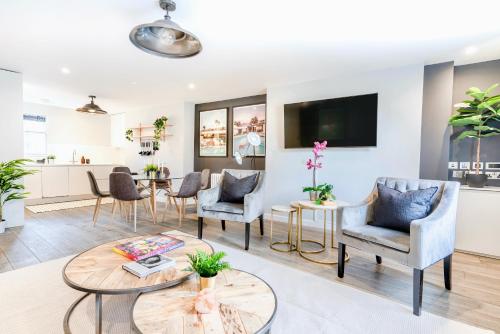 a living room with chairs and a table at Be London - Chinatown Residences in London