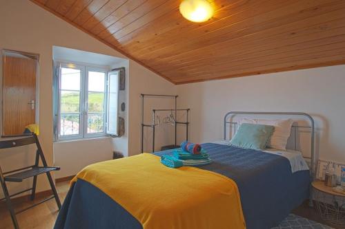 Postel nebo postele na pokoji v ubytování BemMEquer - Açores