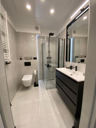 Kúpeľňa v ubytovaní WhiteWave Apartament Pogorzelica