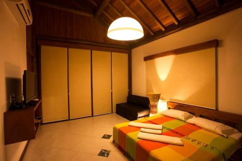 Cama o camas de una habitación en Marauba Beach House - Taipu de Fora