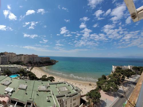 a view of a beach and the ocean at A ESTRENAR PRECIOSOS APARTAMENTOS APARTHOTEL INTER2, NEW APARTMENTS lN APARTHOTEL 12 months open! self check in! RESERVA Garaje! in Salou
