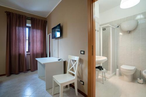 a bathroom with a white sink and a toilet at Gerosa Guest House in Lamezia Terme