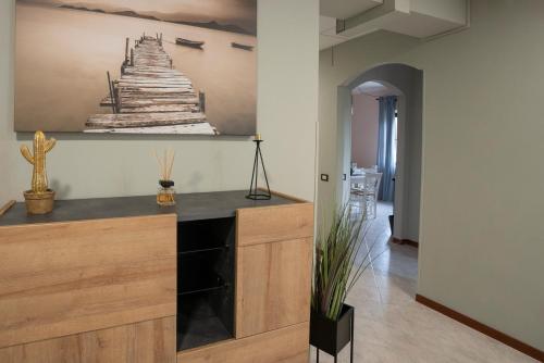 a room with a counter with a painting on the wall at Gerosa Guest House in Lamezia Terme