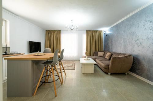a living room with a couch and a table at Armada Aparthotel in Alba Iulia