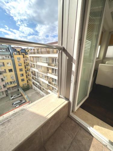 a balcony with a view of a building at Unique Luxurious Jacuzzi PENTHOUSE DUPLEX in City Center! 2 BATHS! FREE PARKING! in Sofia