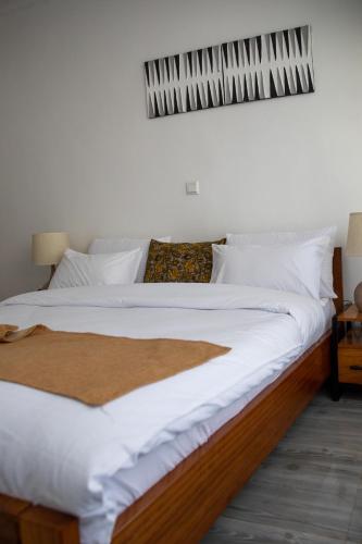 Кровать или кровати в номере IKAZE APARTMENTS