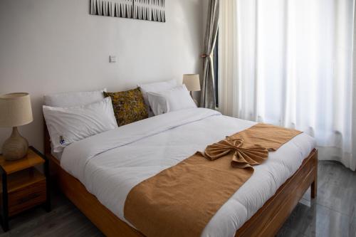 Кровать или кровати в номере IKAZE APARTMENTS