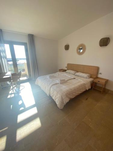 En eller flere senge i et værelse på SUN BAY VILLAS APARTMENT