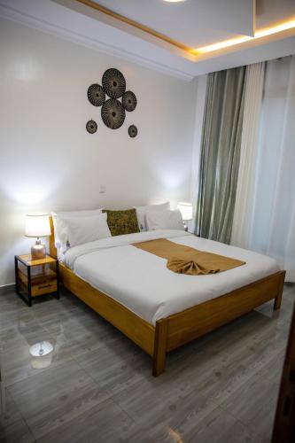 Кровать или кровати в номере IKAZE APARTMENTS