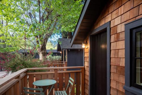 a deck with a table and chairs on a house at Dawn Ranch in Guerneville