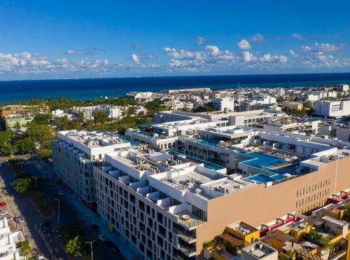 an aerial view of a city with the ocean at IPANA Luxury Apartments by Vacaciones.Yeah in Playa del Carmen