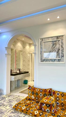 a living room with a couch and a fireplace at جنة الطائف in Taif