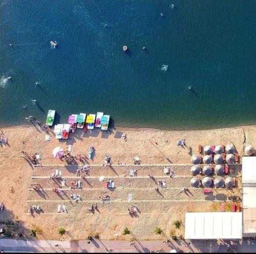 an overhead view of a beach with a group of people at Apartman "N" Srebrno jezero in Ostrovo