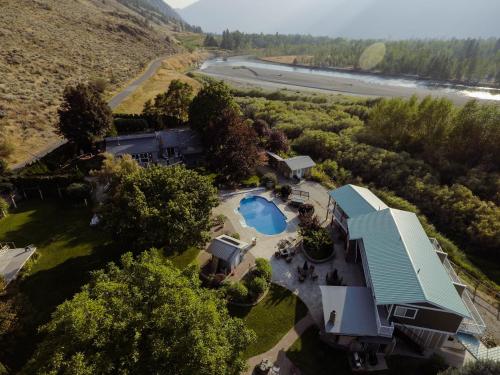 an aerial view of a house with a swimming pool at Similkameen Wild Resort & Winery Retreat in Cawston