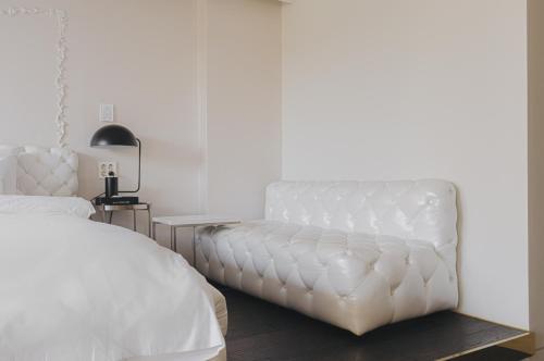 Postel nebo postele na pokoji v ubytování ACC Design Hotel