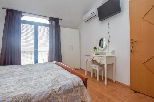 Ένα ή περισσότερα κρεβάτια σε δωμάτιο στο Apartments Studenac