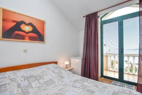 Ένα ή περισσότερα κρεβάτια σε δωμάτιο στο Apartments Studenac
